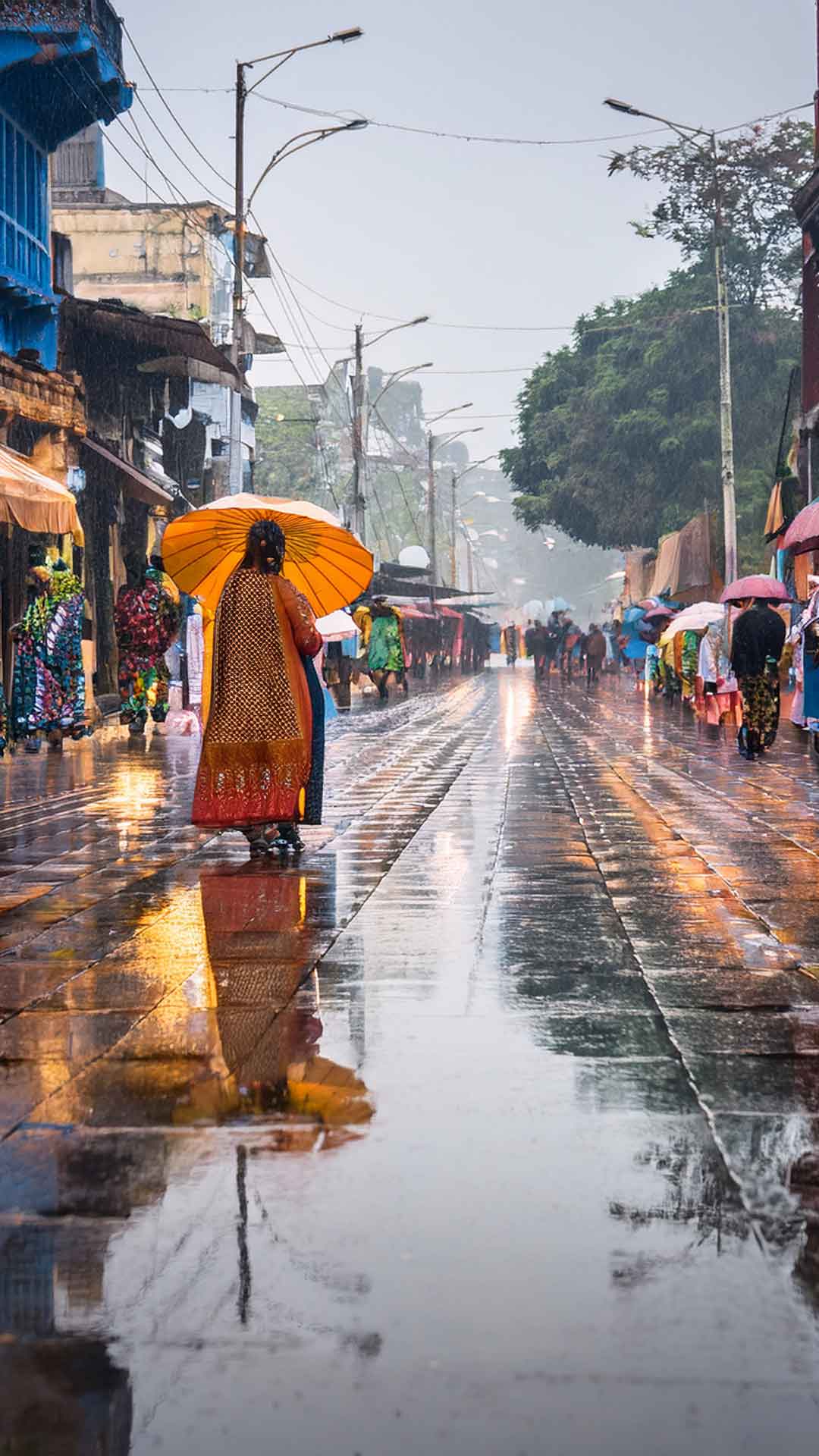 Rainy evening during Hatibagan Durga Puja shopping with glowing signboards